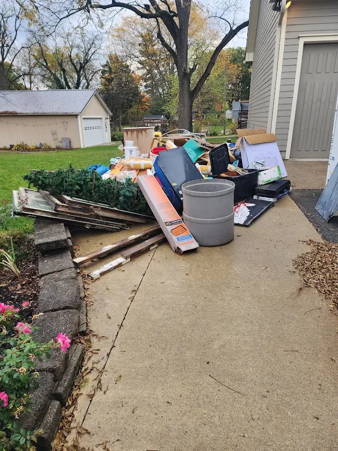 Dumpster being loaded with debris for Estate Cleanout Dumpster Rental in Croton-on-Hudson